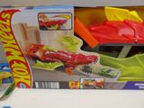 a box with a toy car inside of it on a table