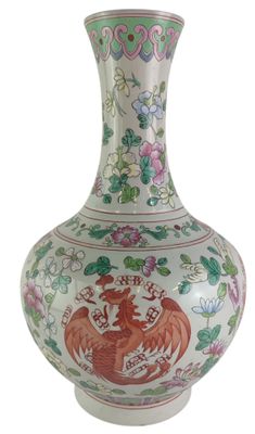 a vase with a dragon on it sitting on a table