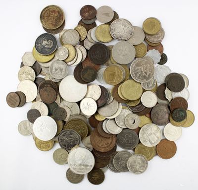 a pile of coins on a white surface