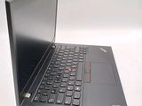 a laptop that is sitting on a white surface