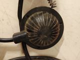 a picture of a corded telephone with a fan on top of it