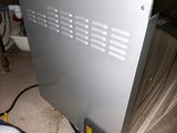 an image of a metal cabinet with a water heater on it