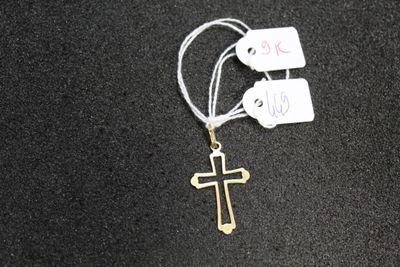 a cross on a string with tags attached to it
