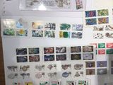 a refrigerator with many different stamps on it in the kitchen