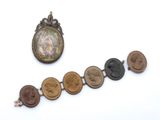 several different types of medals are displayed on a white surface