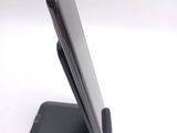a cell phone that is sitting on top of a stand