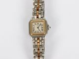 an image of a lady ' s wrist watch with two tone gold and silver bracelets