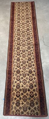 rug on the floor in a room with a chair and a table