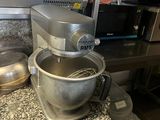 a kitchen counter with a mixer and a bowl on it
