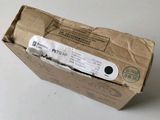 a brown paper bag with a white label on it