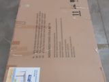 a cardboard box sitting on the floor in a warehouse