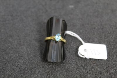 a ring that is sitting on top of a black object