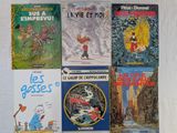 plusieurs livres pour enfants sont alignés sur une surface blanche