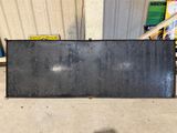 a large metal object sitting on the floor in the garage
