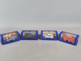 a group of six toy cars in blue boxes on a white surface