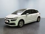 the white citrole is parked in a large room