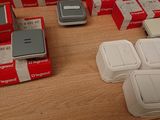 many boxes of electronic devices on a wooden table