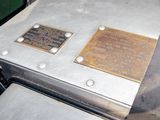 two plaques on the back of a car