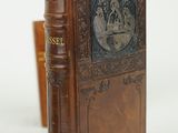 an old book with a picture of a man and a woman on it