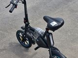 an image of a black electric scooter parked on the street