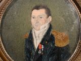portrait of a man in a military uniform in a gold frame