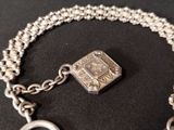 a silver bracelet with a silver clasp on it