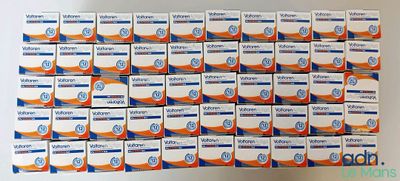 many boxes of toothpaste sitting on top of each other