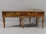 a small wooden table with a painted top and legs