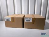 two boxes are stacked on top of each other on a table