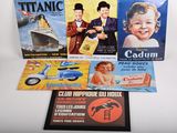 trois livres posés sur une table, avec une image représentant un bateau, une voiture et un bébé