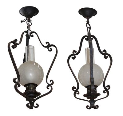 pair of art nouveau style sconces with white glass shades