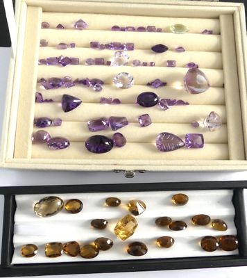 a box with a bunch of different colored stones in it