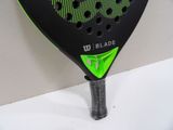 a close up of a tennis racket on a table