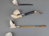 several different types of canes are lined up on a gray surface