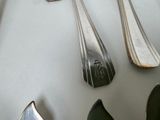 four spoons and two spoon spoons on a table