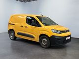 the yellow van is parked in a white room with a black floor