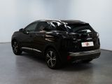 the rear end of a black suv parked in a room