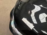a sticker on the hood of a car that is parked