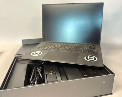 a laptop sitting in a box on a table