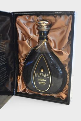 a bottle of wine in a black box on a table