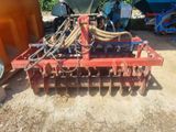 an image of a tractor with a plow attached to it ' s back