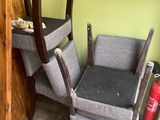 a chair that is next to a table in a room