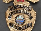 the badge of a police officer is shown on a black surface