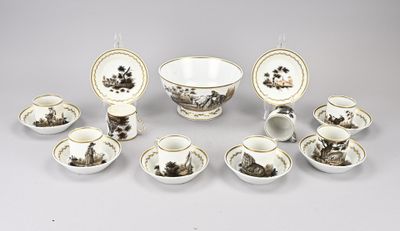 a group of porcelain dishes and cups on a table