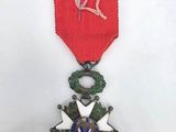 an image of a medal with a ribbon and a star on it
