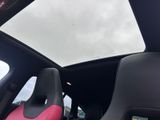 the interior of a car with two seats and a sunroof