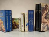 a lot of books that are sitting on a table