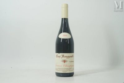 the bottle of red wine is sitting on the table