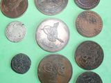a lot of coins that are on a green surface