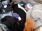 a suitcase full of clothes and clothes that are in it